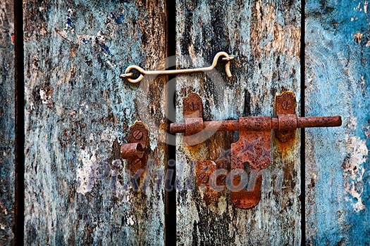 Old rusty latch on the door Old rusty latch on the door