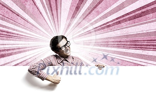 Young man in casual holding white blank banner Young man in casual holding white blank banner