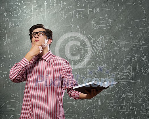 Young man in casual with book in hands Young man in casual with book in hands