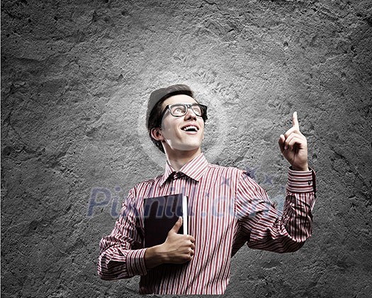 Young man in casual with book in hands Young man in casual with book in hands