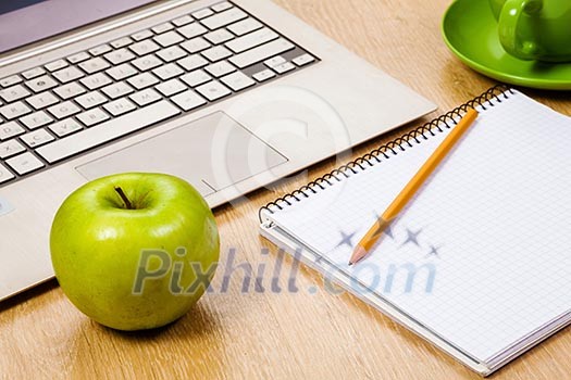 Tablet pc cup of coffee and notepad at table Tablet pc cup of coffee and notepad at table