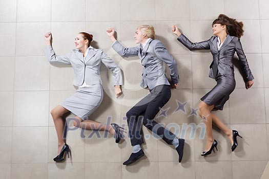 Young people in business suits lying on floor Young people in business suits lying on floor