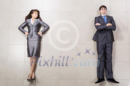 Bossy young businesswoman and handsome confident businessman Bossy young businesswoman and handsome confident businessman