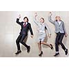 Young people in business suits lying on floor
