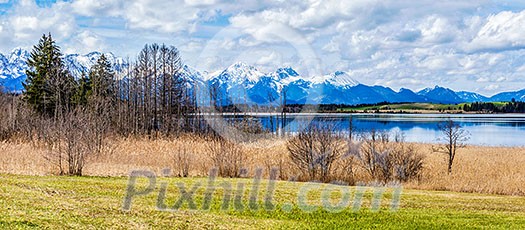 Panorama of Bavarian Alps countryside lake landscape. Bavaria, Germany Panorama of Bavarian Alps countryside lake landscape. Bavaria, Germany
