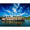 Kerala India travel background - houseboat on Kerala backwaters. Kerala, India