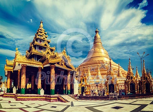 Vintage retro effect filtered hipster style image of Myanmer famous sacred place and tourist attraction landmark - Shwedagon Paya pagoda. Yangon, Myanmar Vintage retro effect filtered hipster style image of Myanmer famous sacred place and tourist attraction landmark - Shwedagon Paya pagoda. Yangon, Myanmar
