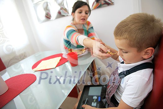 happy young family eating tasty pizza with cheesa and dring healthy and fresh orange juice happy young family eating tasty pizza with cheesa and dring healthy and fresh orange juice