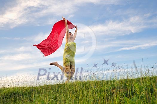 beautiful young and healthy woman run and jump on meadow at sunny day with red scarf beautiful young and healthy woman run and jump on meadow at sunny day with red scarf