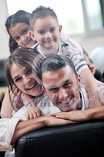 happy young family relax and have fun at modern home indooor happy young family relax and have fun at modern home indooor