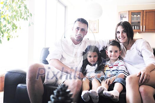 happy young family relax and have fun at modern home indooor happy young family relax and have fun at modern home indooor