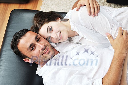 happy young couple relax at modern home livingroom indoor happy young couple relax at modern home livingroom indoor