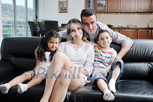 happy young family relax and have fun at modern home indooor happy young family relax and have fun at modern home indooor