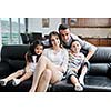 happy young family relax and have fun at modern home indooor