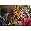 romantic evening date in restaurant  happy young couple with wine glass tea and cake