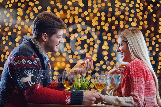 The young man gives a wedding ring gift to girl in restaurant The young man gives a wedding ring gift to girl in restaurant