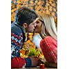 romantic evening date in restaurant  happy young couple with wine glass tea and cake