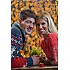 romantic evening date in restaurant  happy young couple with wine glass tea and cake