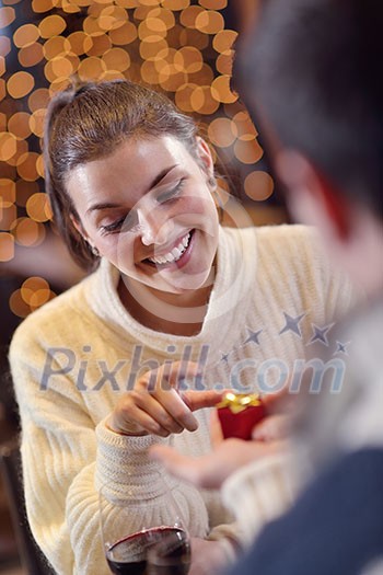 The young man gives a wedding ring gift to girl in restaurant The young man gives a wedding ring gift to girl in restaurant