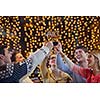 Group of happy young people drink wine at party disco restaurant
