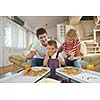 happy young family eating tasty pizza with cheesa and dring healthy and fresh orange juice