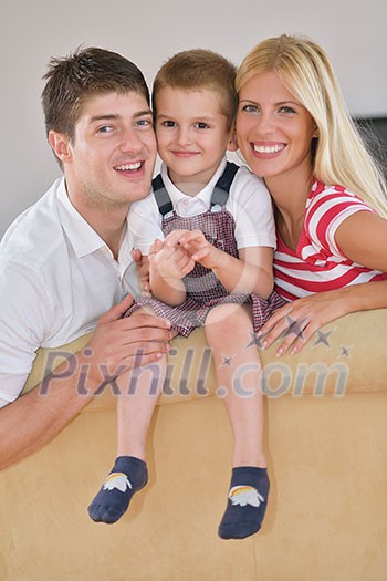 happy young family with kids in bright modern living room have fun and looking big flat lcd tv happy young family with kids in bright modern living room have fun and looking big flat lcd tv