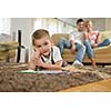 happy young family teach leassons and prepare their son for school while draw on board at home
