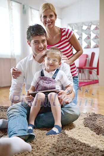 happy young family with kids in bright modern living room have fun and looking big flat lcd tv happy young family with kids in bright modern living room have fun and looking big flat lcd tv