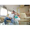 pregnant woman with her husband have fun relax and using tablet comture at modern home