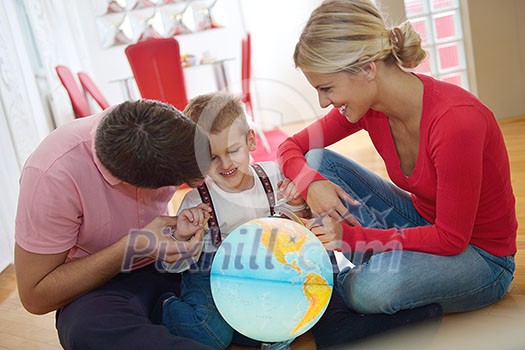 happy young family have fun with globe happy young family have fun with globe