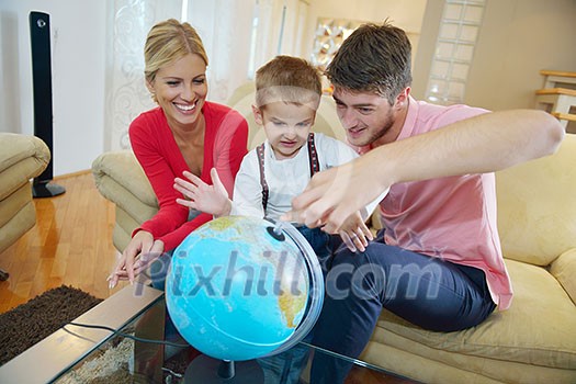 happy young family have fun with globe happy young family have fun with globe