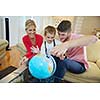 happy young family have fun with globe