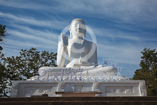 White sitting Budha image. Mihintale, Sri Lanka White sitting Budha image. Mihintale, Sri Lanka