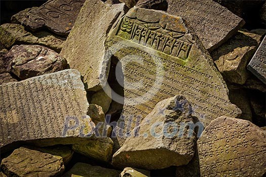 Buddhist prayer mantras on stones in Tibetan Buddhism temple Buddhist prayer mantras on stones in Tibetan Buddhism temple