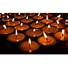 Burning candles in Tibetan Buddhist temple. Himachal Pradesh, India