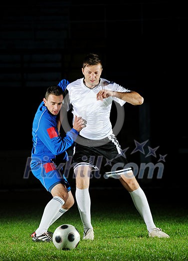 competition Action run and jump Duel of football players at soccer ball stadium at night competition Action run and jump Duel of football players at soccer ball stadium at night