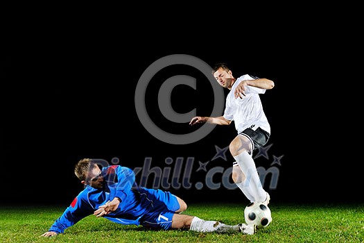 competition Action run and jump Duel of football players at soccer ball stadium at night competition Action run and jump Duel of football players at soccer ball stadium at night