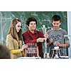 science and chemistry classees at school with smart children and teacher 