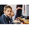 it education with children group  in school at computer science class learning leassons and practice typing 