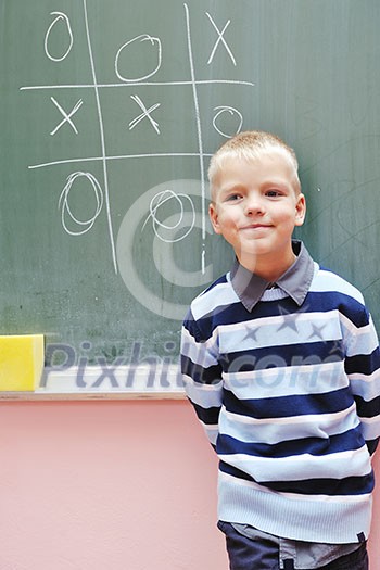 happy young boy at first grade math classes solving problems and finding solutions happy young boy at first grade math classes solving problems and finding solutions