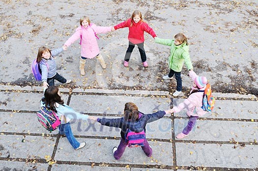 happy young child group outdoor standing together in circle formation and representing teamwork and friendship concept happy young child group outdoor standing together in circle formation and representing teamwork and friendship concept