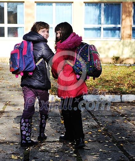 happy school girls running outdoor at sunny autumn day happy school girls running outdoor at sunny autumn day