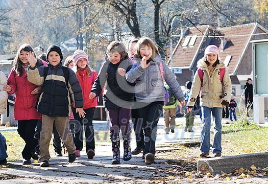happy school girls running outdoor at sunny autumn day happy school girls running outdoor at sunny autumn day