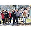 happy school girls running outdoor at sunny autumn day 