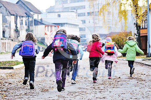 happy school girls running outdoor at sunny autumn day happy school girls running outdoor at sunny autumn day