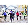 happy school girls running outdoor at sunny autumn day 