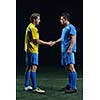 soccer player doing kick with ball on football stadium  field  isolated on black background