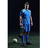 soccer player doing kick with ball on football stadium  field  isolated on black background