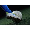 soccer player doing kick with ball on football stadium  field  isolated on black background