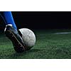 soccer player doing kick with ball on football stadium  field  isolated on black background